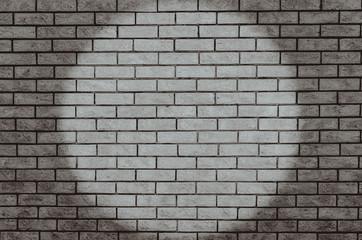 Fototapeta na wymiar Spotlight on brick wall