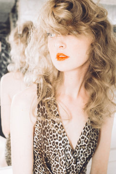 Portrait of woman in leopard skin pattern sleeveless top