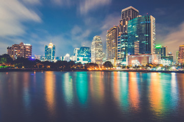 Fototapeta na wymiar Bangkok city downtown at night with reflection of skyline, Bangk