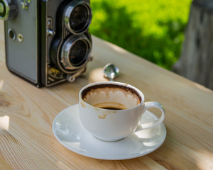 camera and a cup of coffee