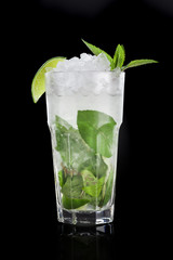 Mojito cocktail over black background
