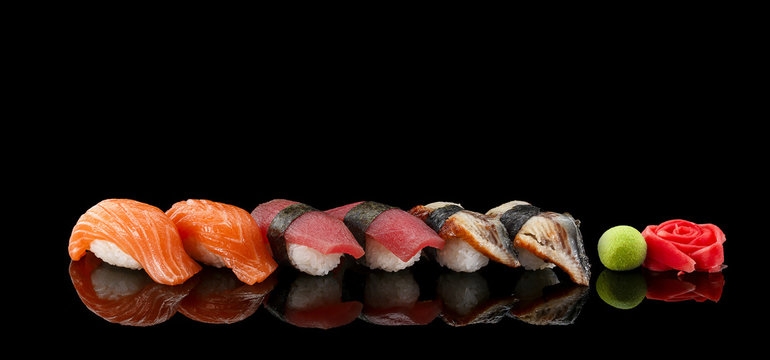 Sushi nigiri set over black background