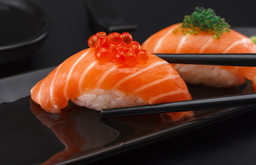 Sushi nigiri over black background