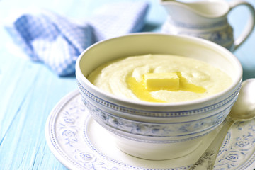 Semolina porridge with butter in a vintage bowle .