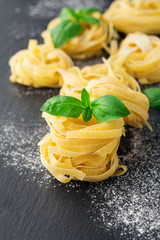 Raw pasta and basil