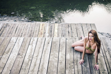 GIrl on lake wearing monokini.