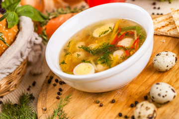 Soup with chicken meatballs, vegetable and quail eggs