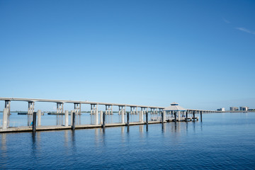 Fototapeta na wymiar Pier and Bridge in Fort Myers