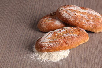 Bread flour on wooden background