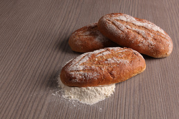 Bread flour on wooden background