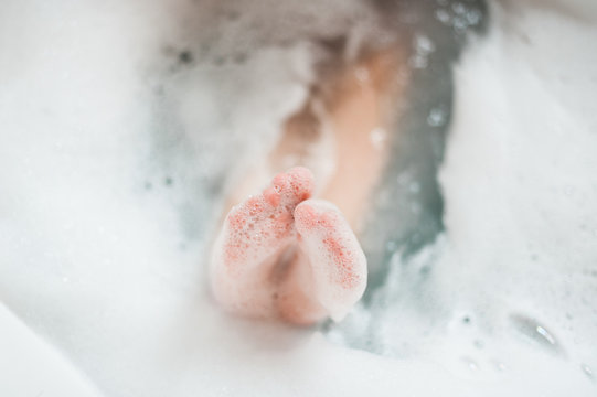 Foot sticking out of bath water