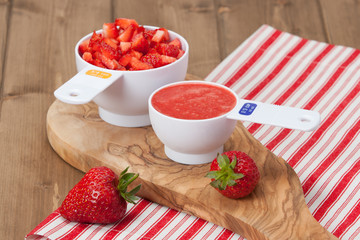 Sliced Strawberries And Strawberry Puree In Measuring Cups. Oliv