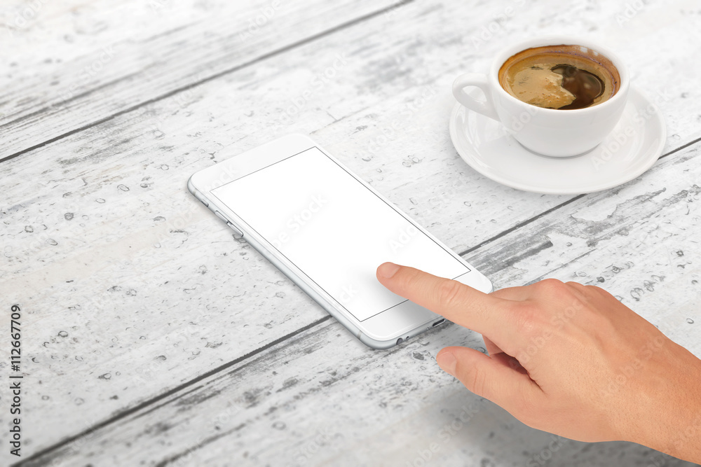 Poster man touch smart phone with blank screen for mockup. isometric view. cup of coffee beside on table.
