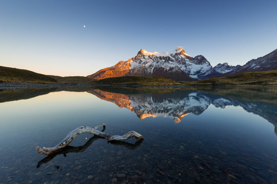 Paine Grande reflected in a small cove of  Lago Nordenskj_ld at sunrise