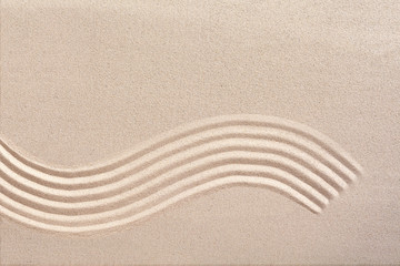 Fototapeta na wymiar Curving wave pattern in a Japanese zen garden
