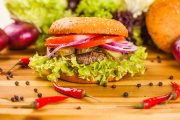 Hamburger on wooden cutting board