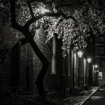 B&W Photo of an atmospheric gas lit street at night