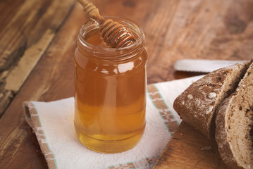 honey and bread on a countryside breakfast - closeup
