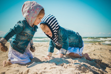 two girls playing on the beach