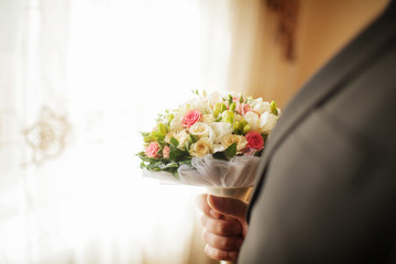young man waiting woman.Groom waiting bride.Just married. Close up. Bridal wedding bouquet of flowers