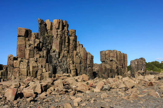 Columns of basalt with dyke intrusion in quarry. Bombo, New South Wales Australia.