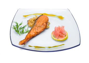 Salmon steak with rice and ginger on a transparent plate. Isolated on white background.