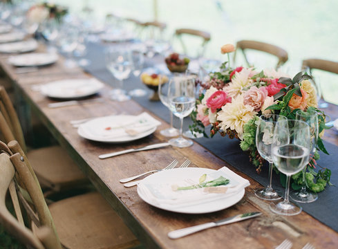 Table set with plates and flowers