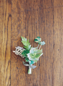 Wedding buttonhole on wooden surface