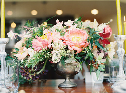 Colorful flowers in vase arranged on a table