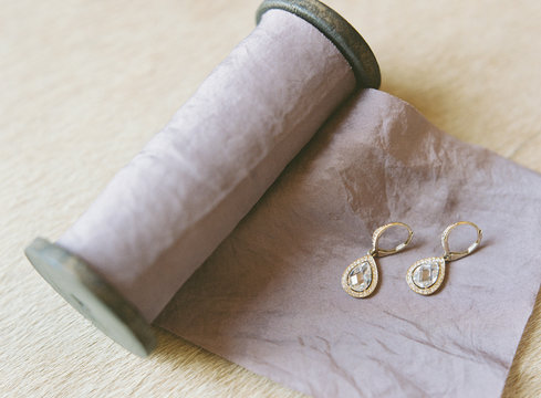 Pair of Earrings on blue ribbon