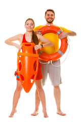 Lifeguards with rescue and ring buoy lifebuoy.
