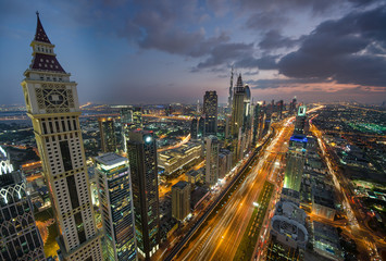 Fototapeta na wymiar Dubai by night. Sheikh Zayed Road skyscrapers. 