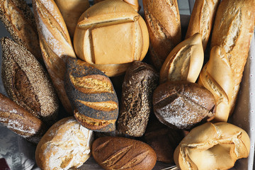 Many mixed breads and rolls.