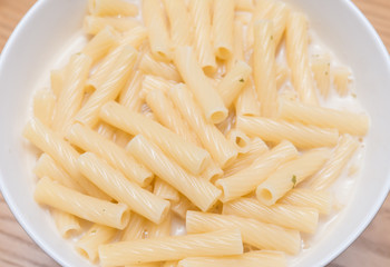 fresh italian pasta with cheese sauce in a bowl