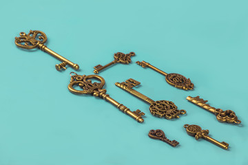 Eight Antique Skeleton Keys on Turquoise Background