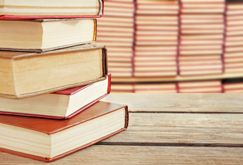 Books on desk in library. School concept