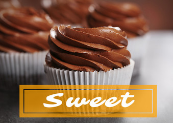 Chocolate cupcakes on grey background, close up