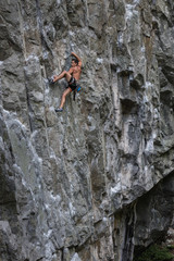 Rock Climber climbing a steep cliff. Taken near Squamish, British Columbia, Canada