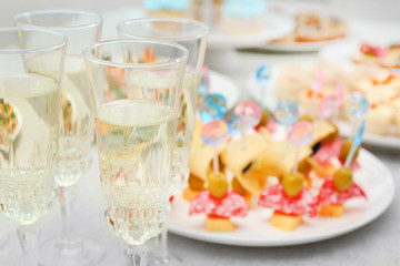 Set of cold snacks, canape, beverages, closeup