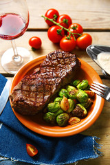 Grilled steak with vegetables, closeup