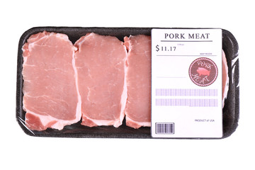 Packed pieces of pork meat, isolated on white