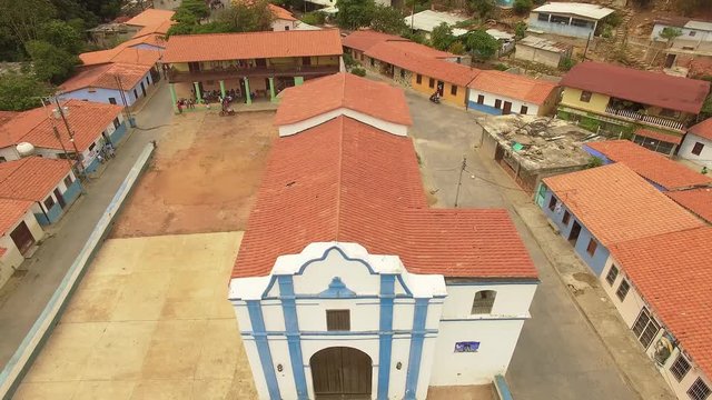 Aerial view of the Church and main cocoa drying plaza at Chuao, Venezuela. Chuao is best known to grow the best and finest cocoa in the world and a very popular beach in the central coast of Venezuela