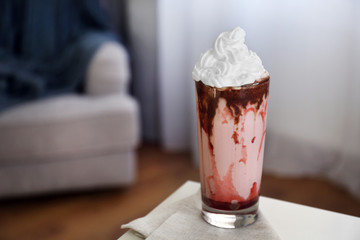 Fresh milk cocktail on table indoors