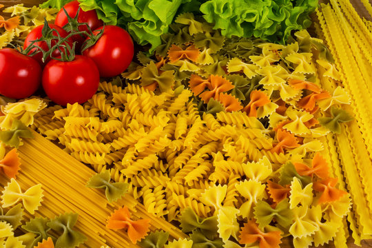 Various types of Italian pasta and cherry tomato