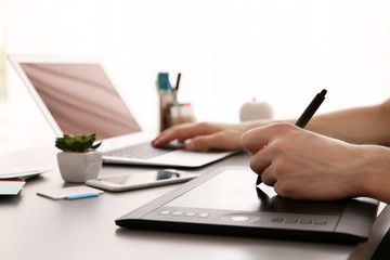 Man using graphic tablet at office