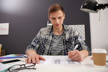 Man working with drawings at office