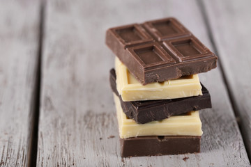 Mix of chocolate on wooden table
