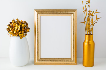 Frame mockup with golden vase