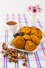 Homemade cookies, nuts  and cup of tea