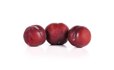 Plums close up isolated on white background